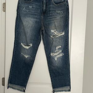 New never worn distressed jeans.
